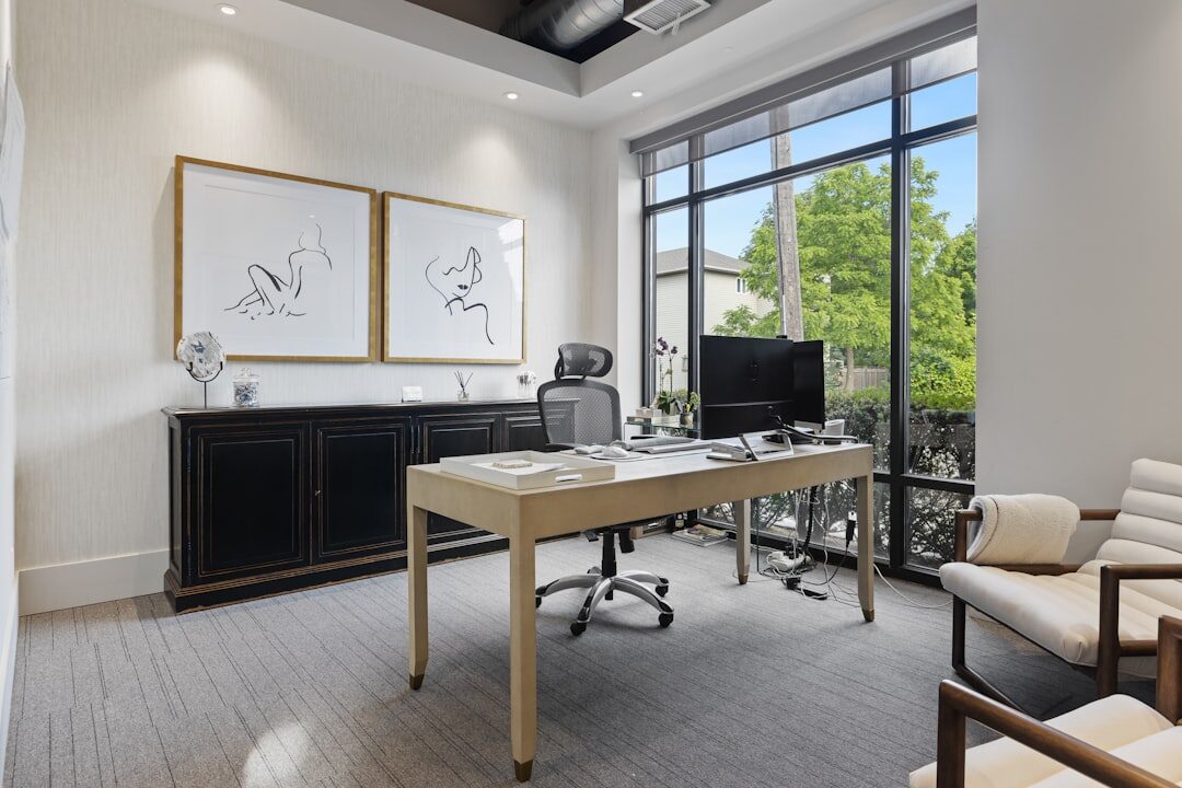 Modern office interior with desks and large windows