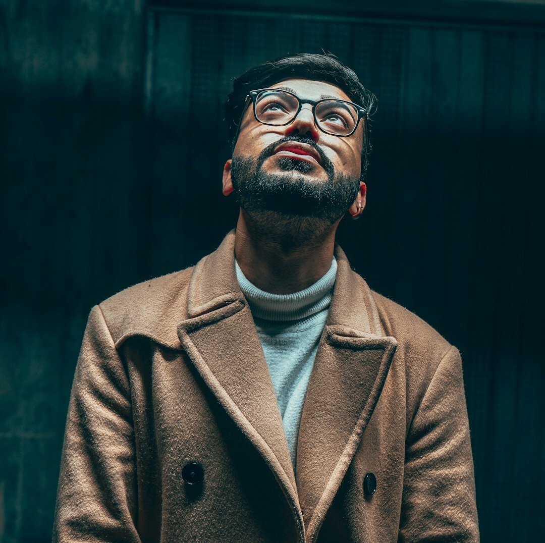 Professional man with beard and glasses in media production
