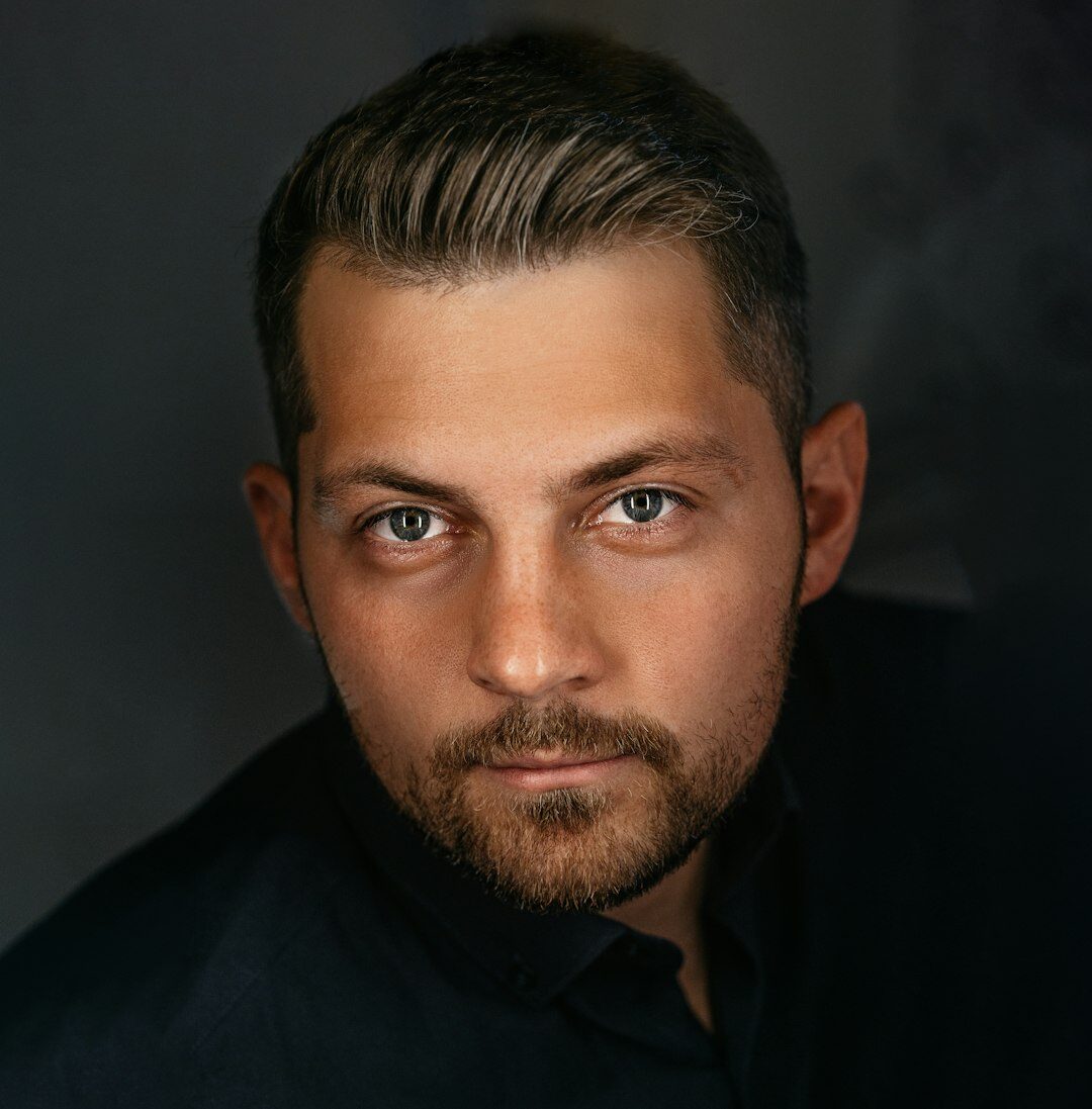 Professional Brazilian man in business casual outfit smiling