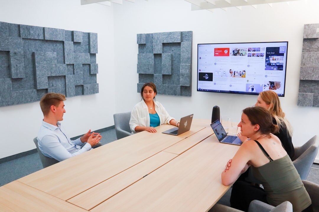 Media production team planning editorial workflow in conference room